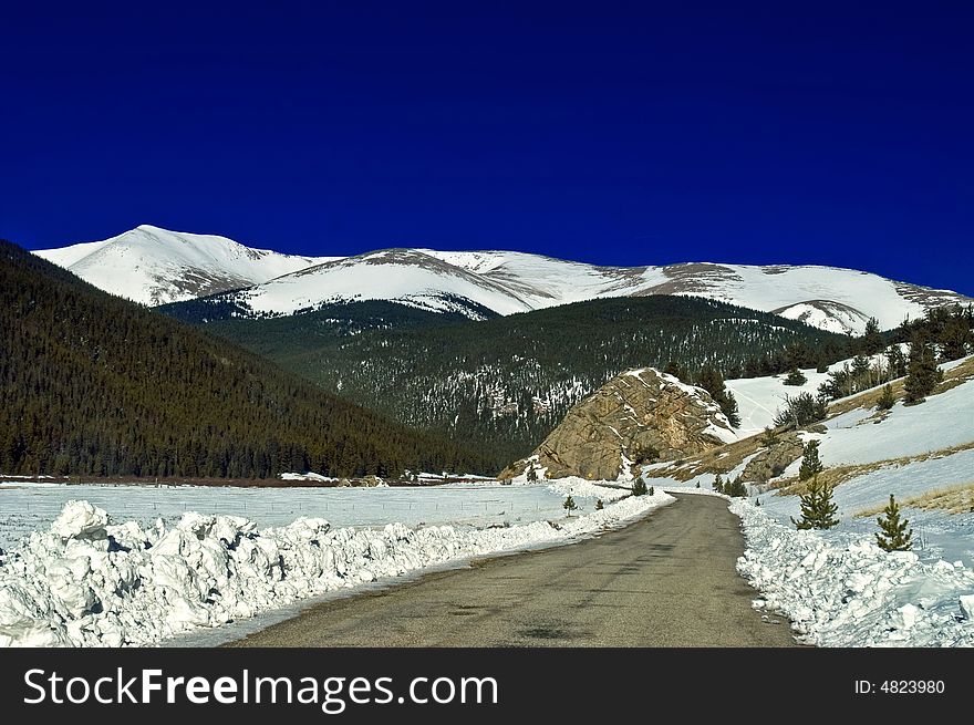 A Snowy Road In Colorado During Winter