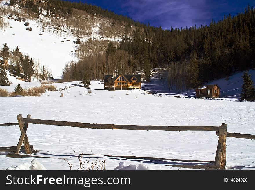 Colorado mansion log home in snow