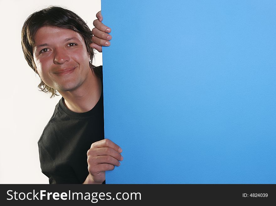 Smiling man holding a billboard