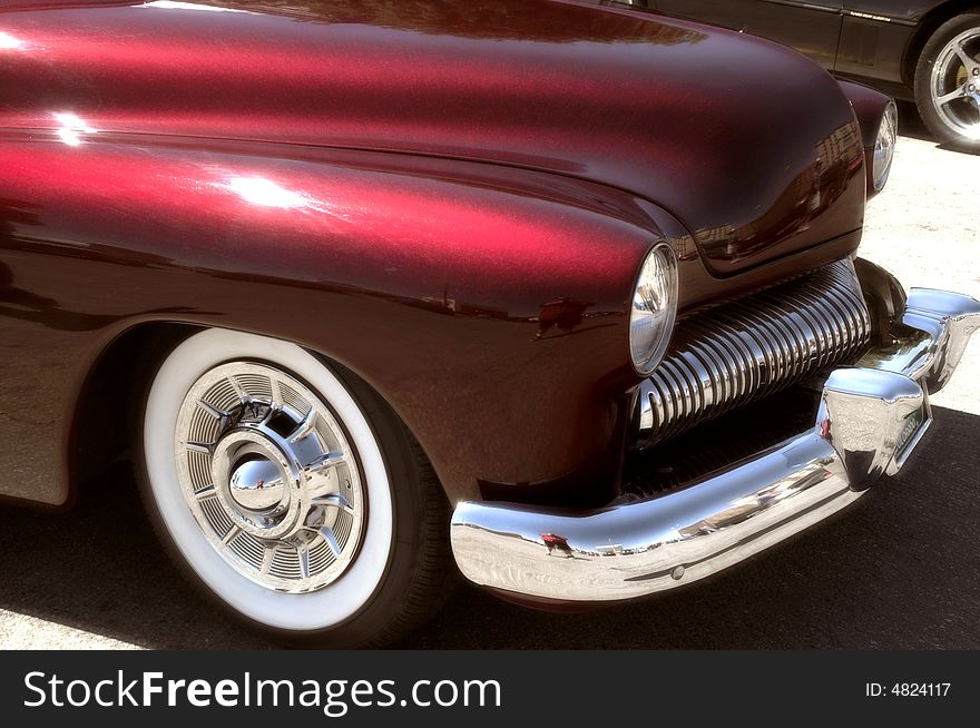 A classic red  custom 50s America car. A classic red  custom 50s America car