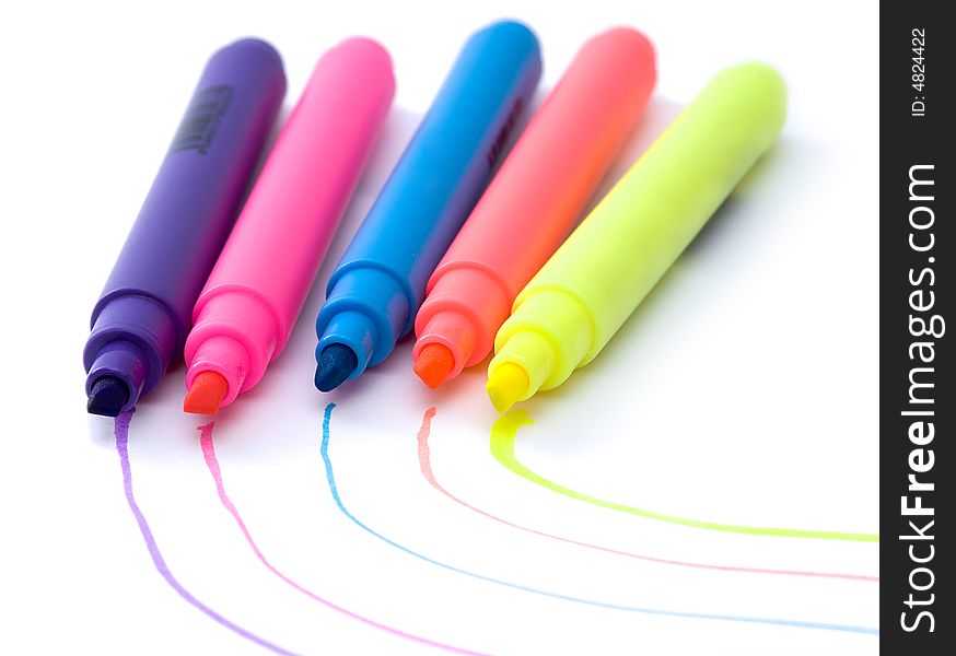 Five colored highlighter pens on white background. Five colored highlighter pens on white background