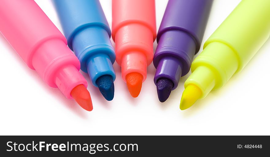 Five colored highlighter pens on white background. Five colored highlighter pens on white background