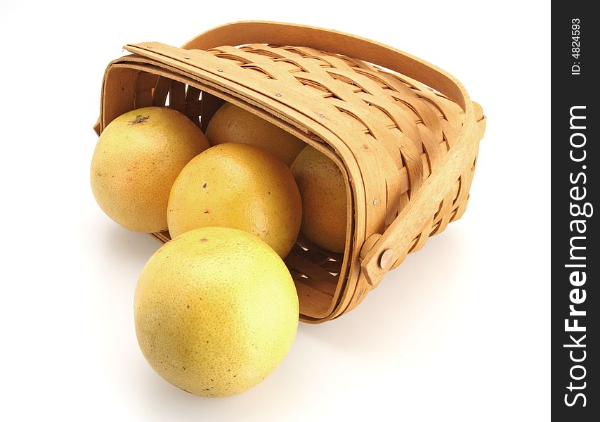 Fresh Oranges rolling out of basket made of wicker. Fresh Oranges rolling out of basket made of wicker