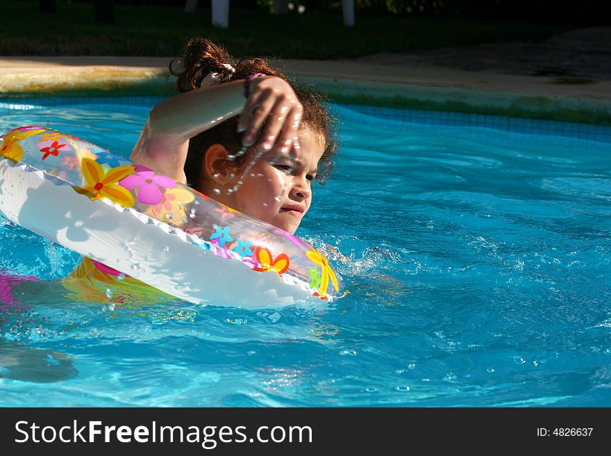 Young girl Swimming yo in Pool. Young girl Swimming yo in Pool