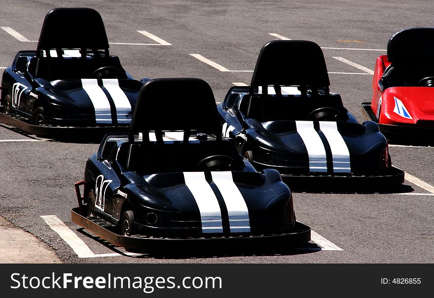 3 black and one Red Go Karts ready to go. 3 black and one Red Go Karts ready to go