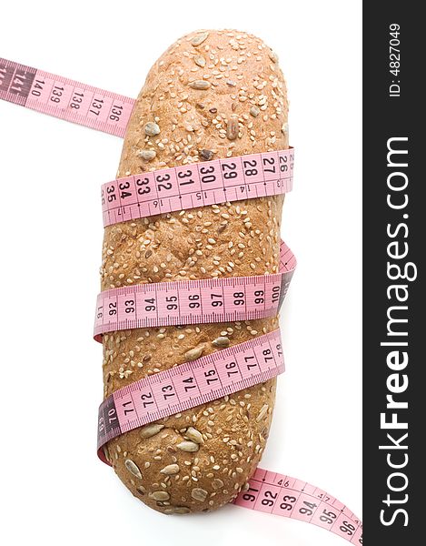 Bread wrapped with a measurement tape on a white background