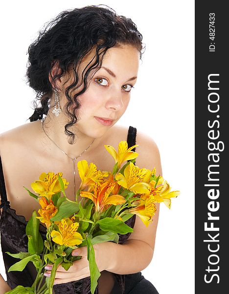 The beautiful girl holds flowers