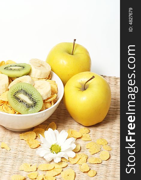 Healthy breakfast.Cornflakes and fruits with flower.