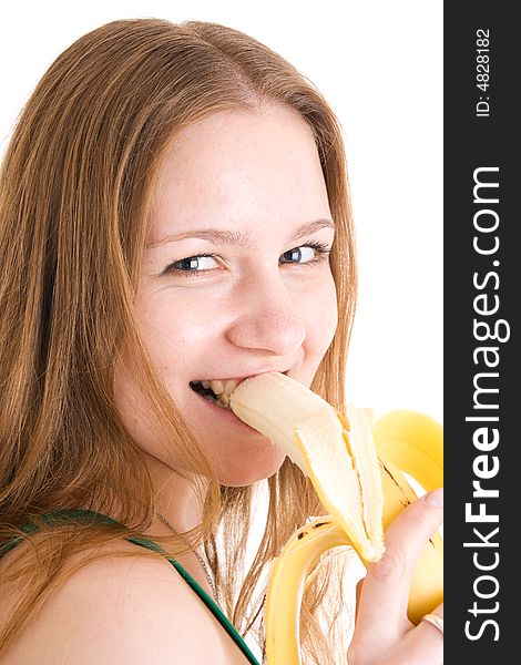 The young attractive girl with a banana isolated on a white background