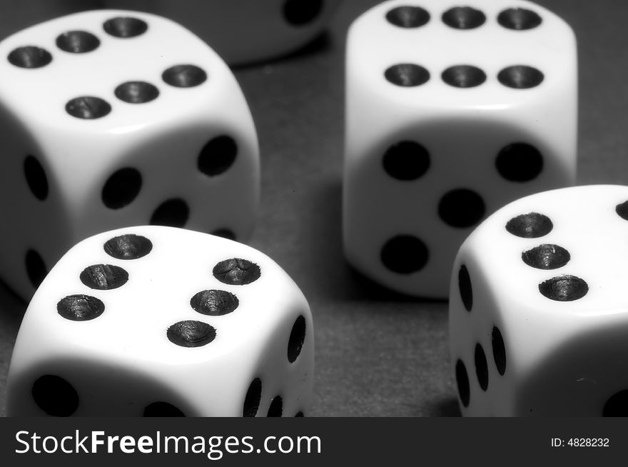 White dices on black background