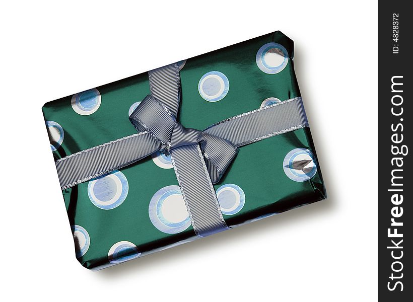 Green coloured wrapping paper with grey ribbon. Green coloured wrapping paper with grey ribbon