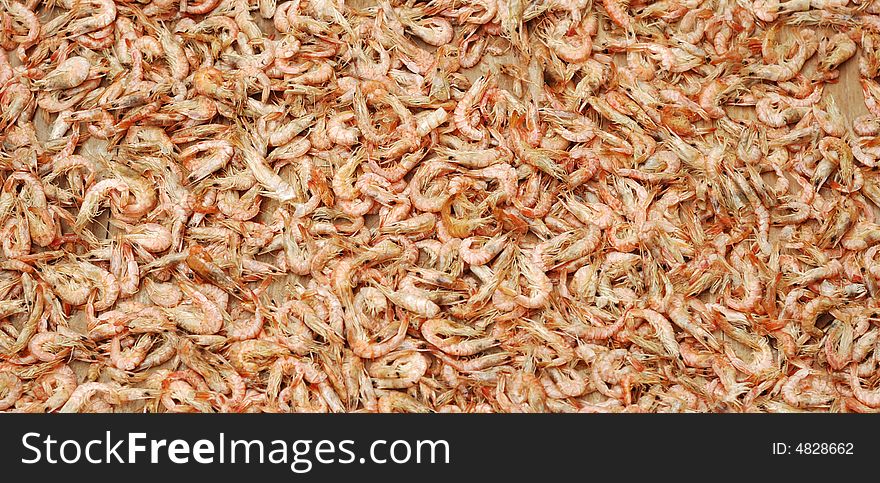 It is making dried shrimps food. It is making dried shrimps food.