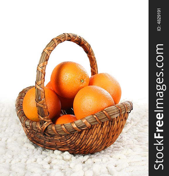 Basket with oranges isolated on white background. Basket with oranges isolated on white background