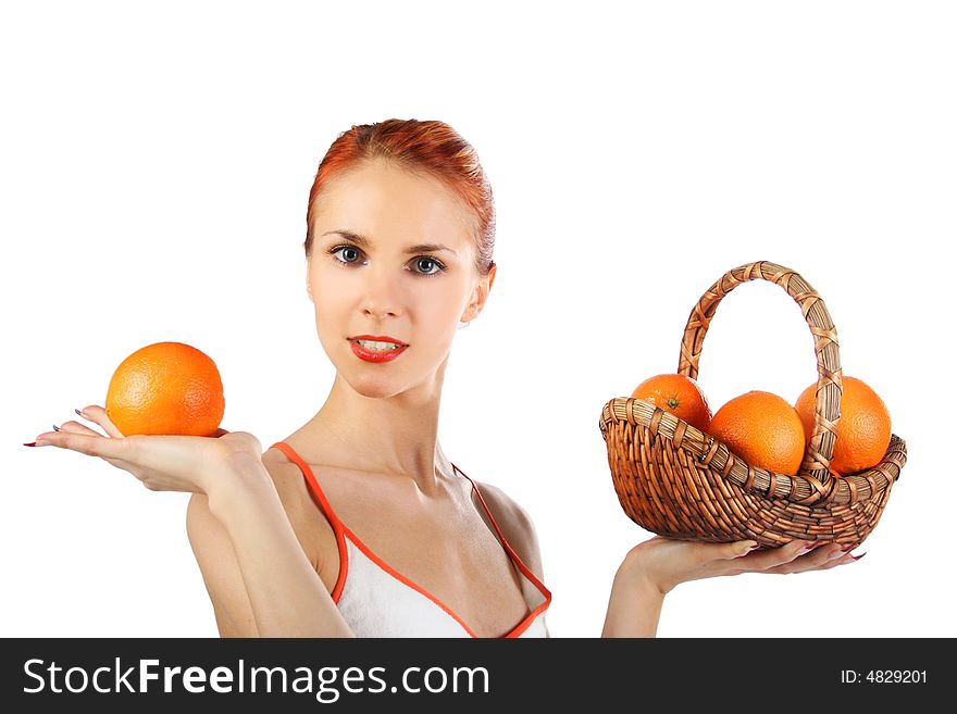 Redhead girl with basket of fresh oranges