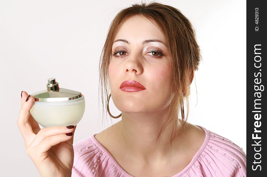 Beautiful woman applying perfume on her body. Beautiful woman applying perfume on her body