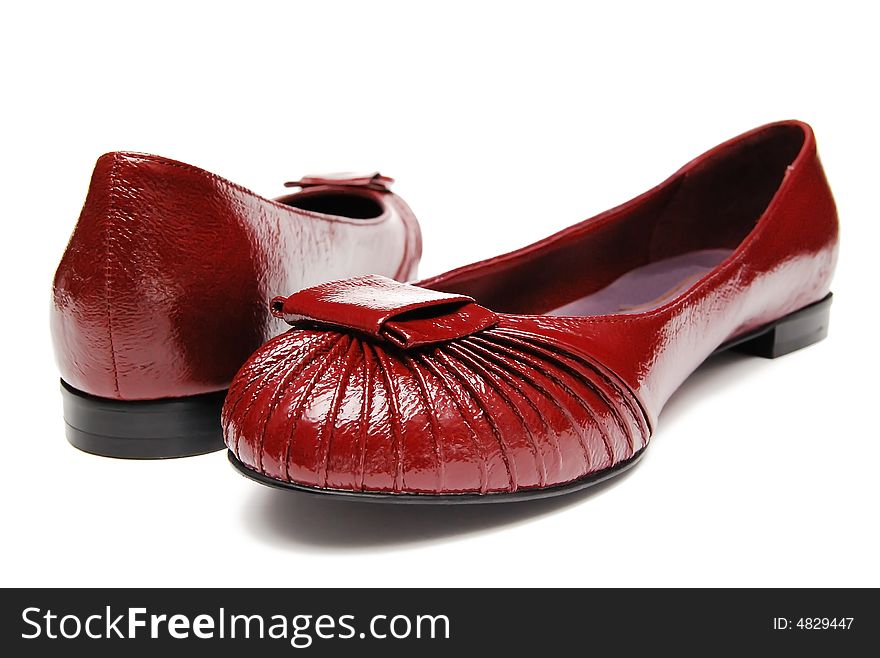 Red womanish shoes on a white background