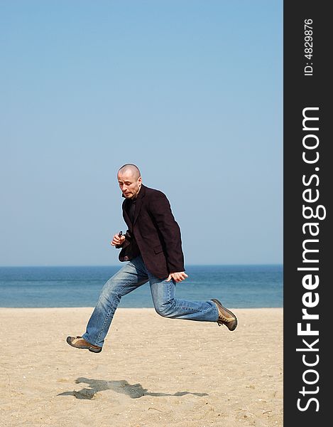 Happy man jumping on sky background. Happy man jumping on sky background