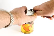 Opening A Can Of Fruit With A Pocket Knife Royalty Free Stock Image