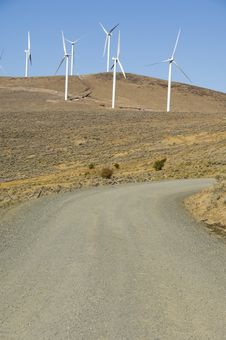 Gravel Road Among Wind Turbines. Stock Photos Gravel Road Among Wind Turbines. Stock Photos