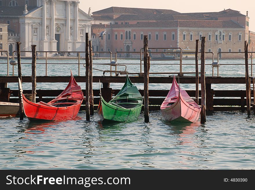 Gondola coloured of three colors, red, green and pink in venice. Gondola coloured of three colors, red, green and pink in venice