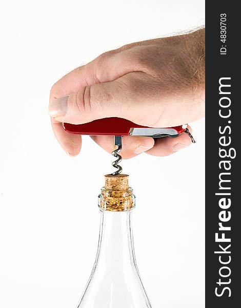 Pocket knife with a corkscrew and a bottle, on white background