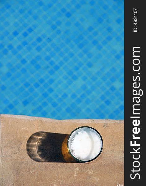 Glass of Beer on the edge pool
