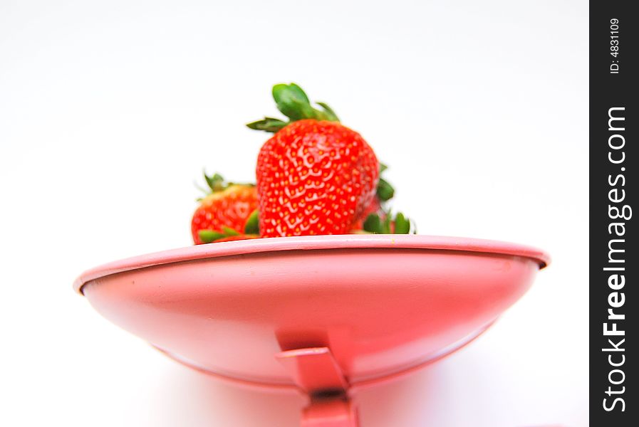 Red Strawberries in weighing scales. Red Strawberries in weighing scales