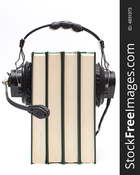 Audiobook conception with headphones and books