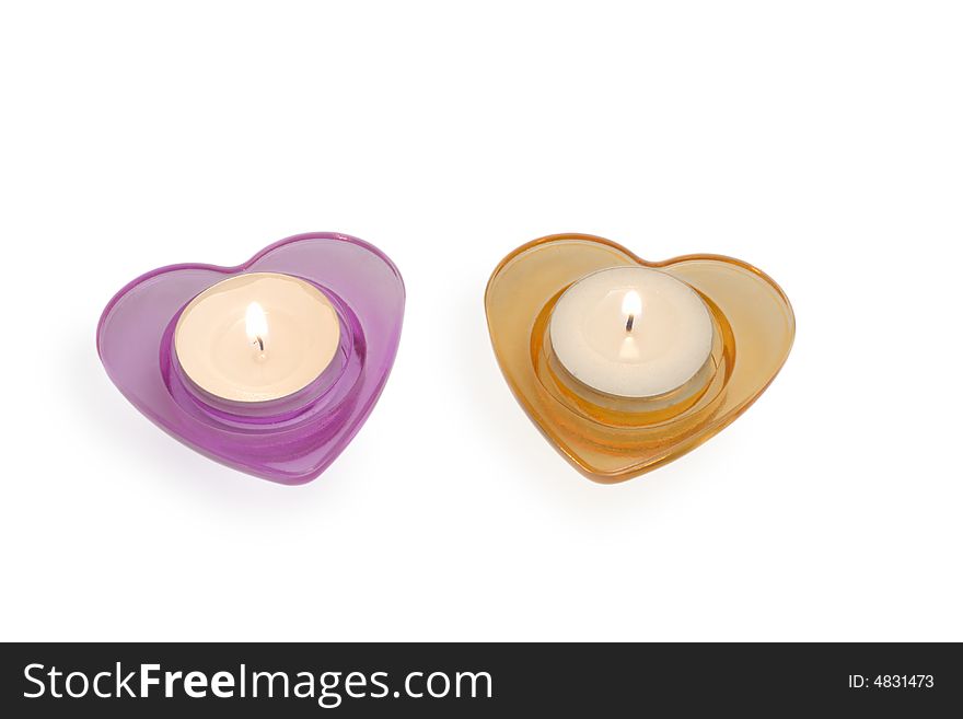 Magenta and orange heart-like candlestiks isolated over white. Magenta and orange heart-like candlestiks isolated over white