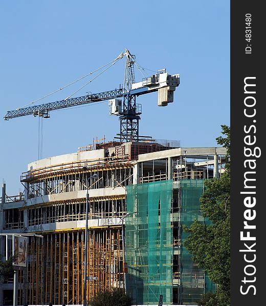 A under construction house on a background of the blue sky. A under construction house on a background of the blue sky