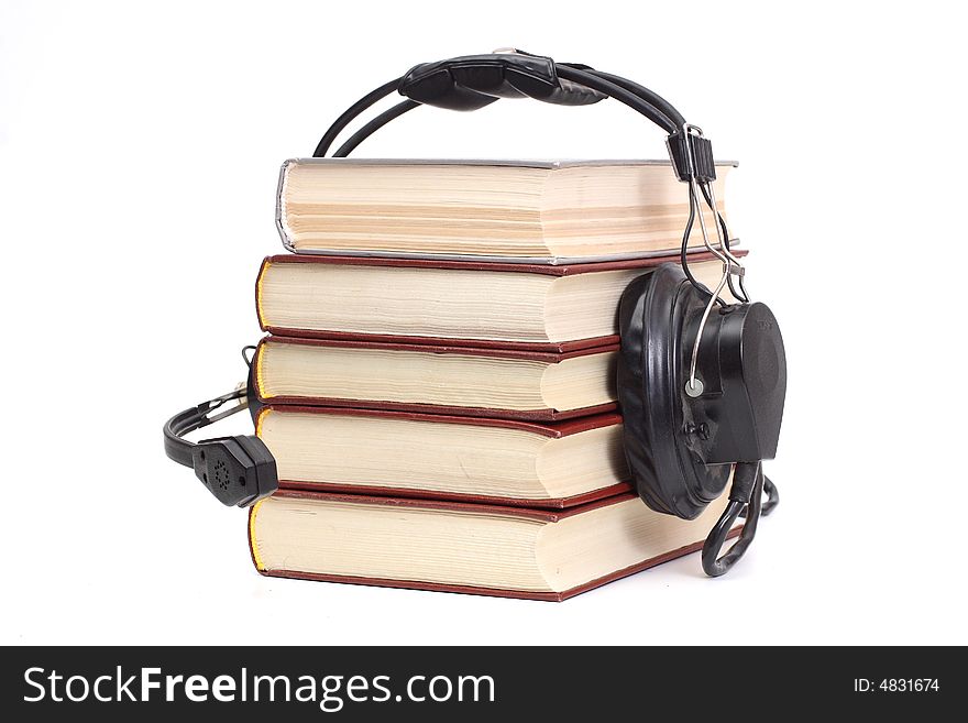 Audiobook conception with headphones and books