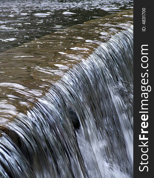 Water flows along a mountain stream