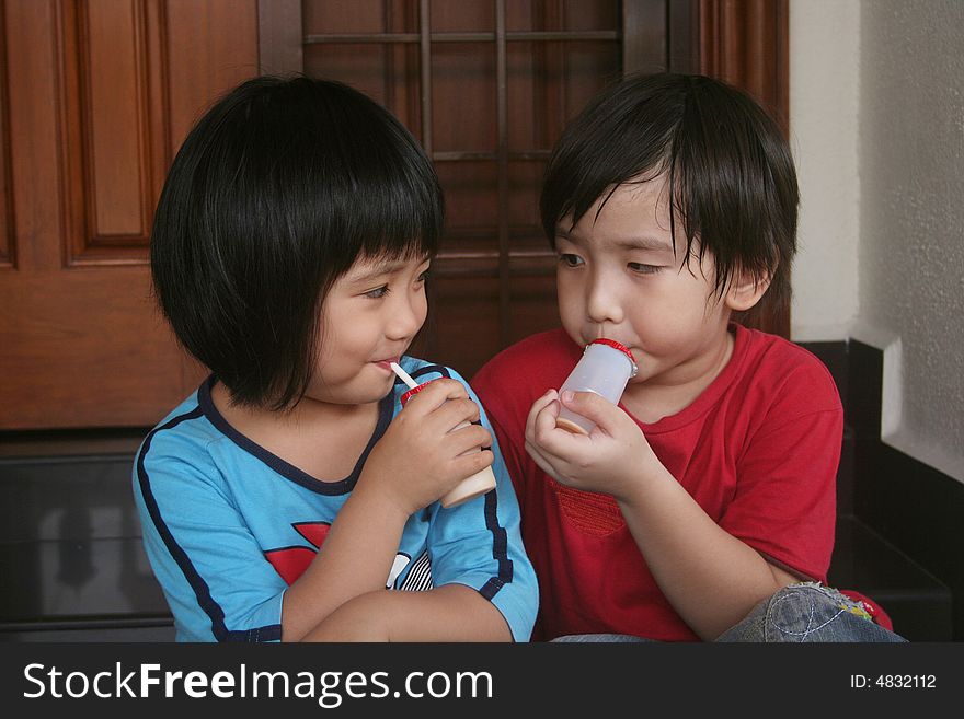 Girl And Boy Drinking Yogurt Free Stock Images & Photos 4832112