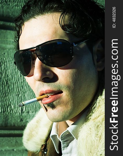 Sexy man smoking cigarette