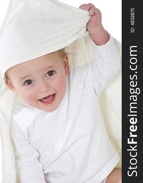 Cute little boy draped in white towel after refreshing bath. Cute little boy draped in white towel after refreshing bath