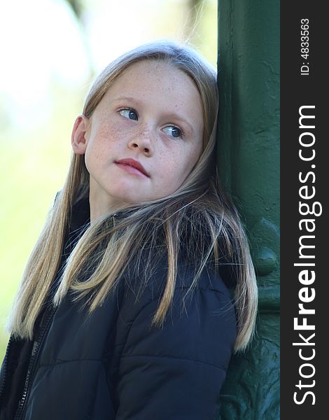 A white caucasian girl child with a bored expression on her face. A white caucasian girl child with a bored expression on her face