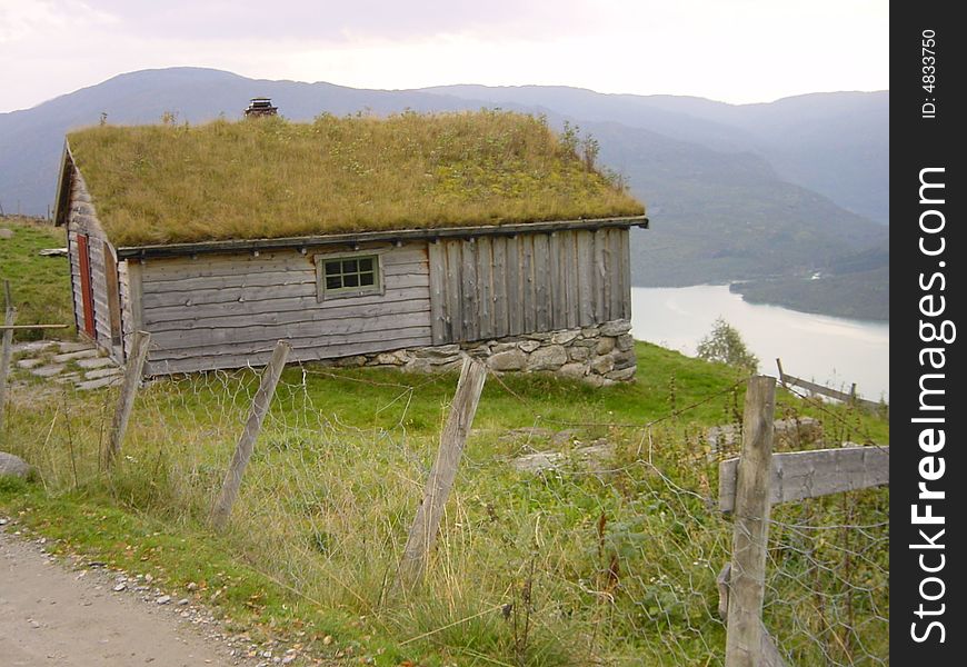 Typically Norway weekend house with grass on roof. Typically Norway weekend house with grass on roof