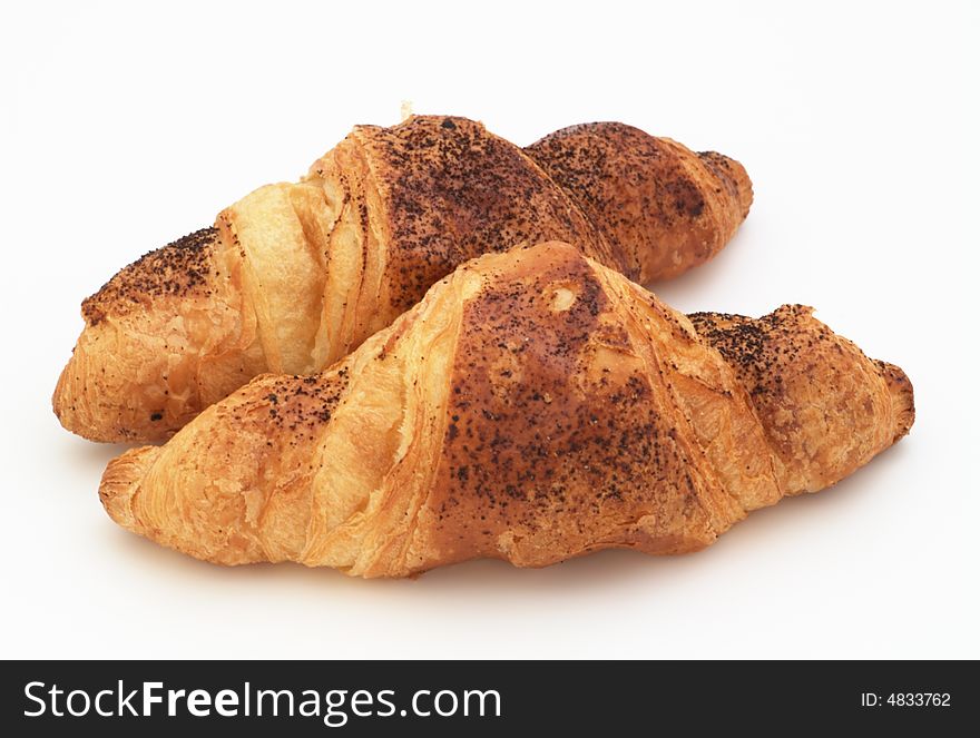 Croissants with cinnamon isolated on white background