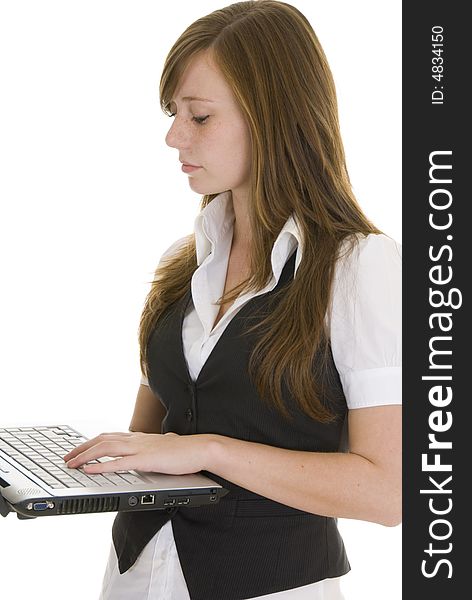 Pretty young lady dressed in black and white business attire isolated on white background, holding a laptop computer. Pretty young lady dressed in black and white business attire isolated on white background, holding a laptop computer.