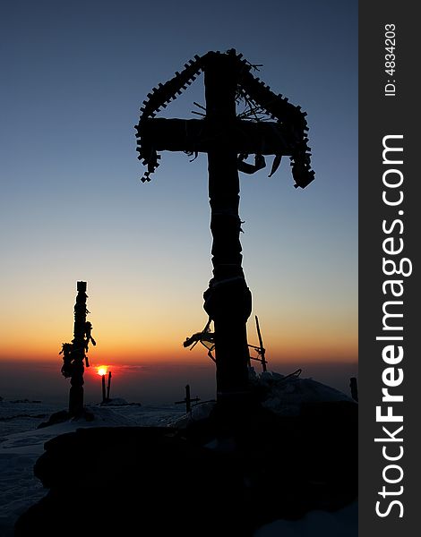 Cross silhouette at the sunset