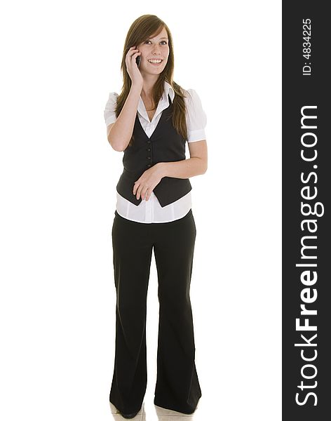 Pretty young lady dressed in black and white business attire isolated on a white background, talking on a mobile phone. Pretty young lady dressed in black and white business attire isolated on a white background, talking on a mobile phone.