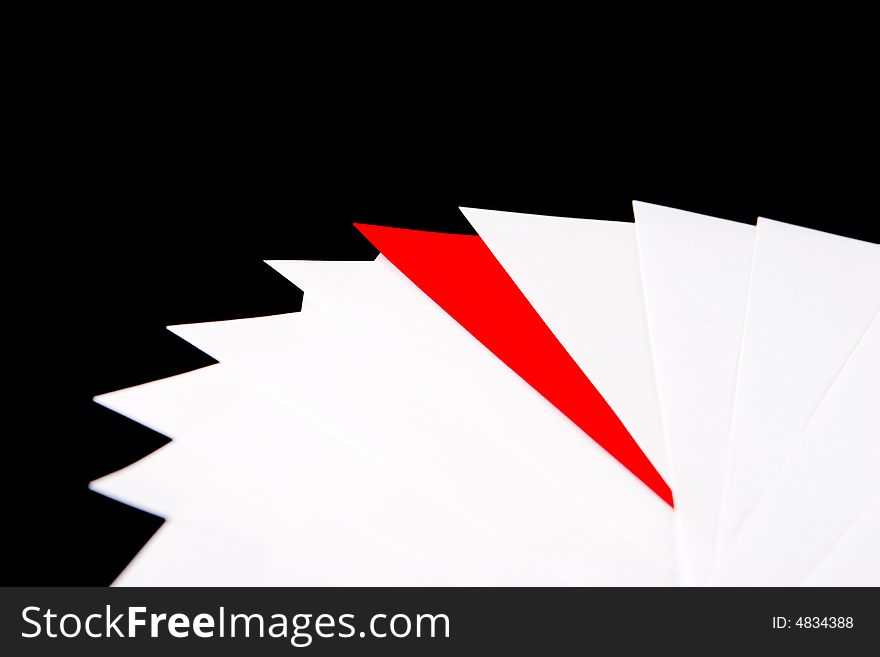 Red envelope in a pile of white envelopes. Red envelope in a pile of white envelopes