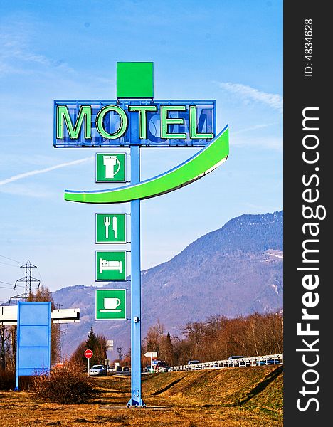 Motel sign on blue sky background. France