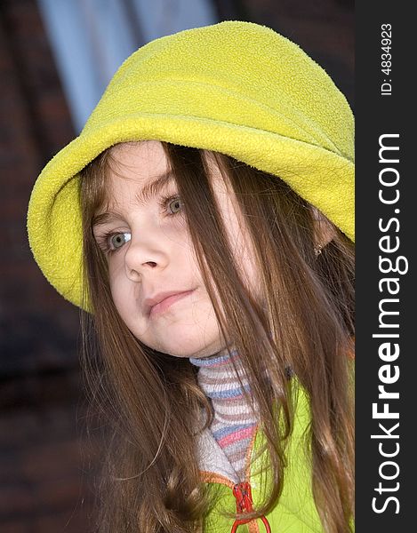 Little pretty girl wearing a green hat