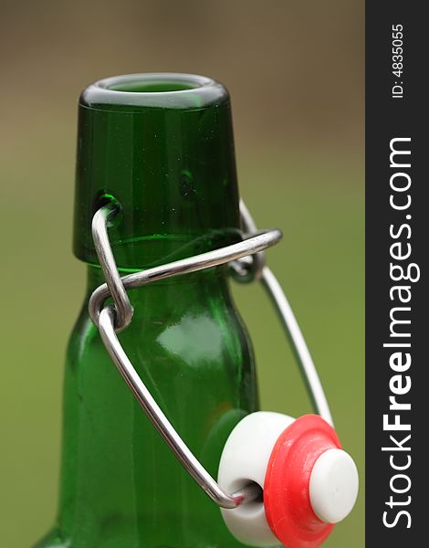 Green bottle with wire cap. Green bottle with wire cap