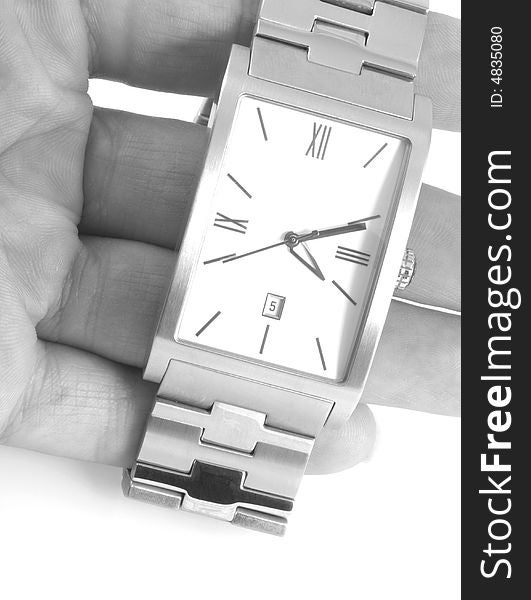 Close up of a hand holding a watch, in black and white. Close up of a hand holding a watch, in black and white.