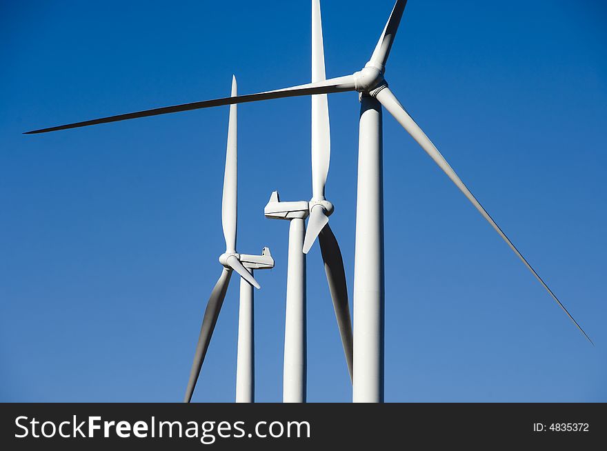 Wind turbines, blue sky.