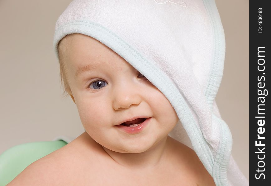 Smiling baby with towel on his head after bath. Smiling baby with towel on his head after bath