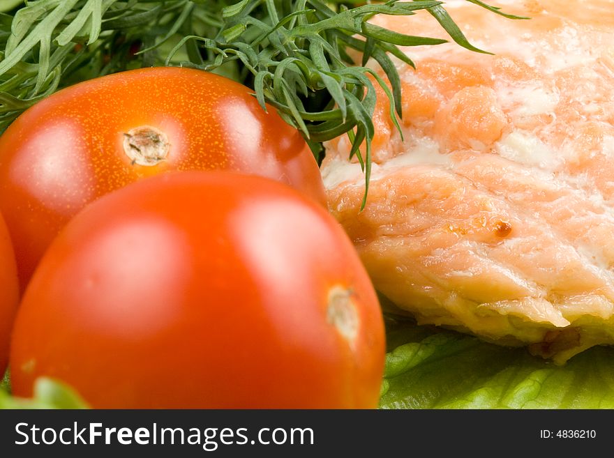 Stake from a salmon with vegetables on a plate