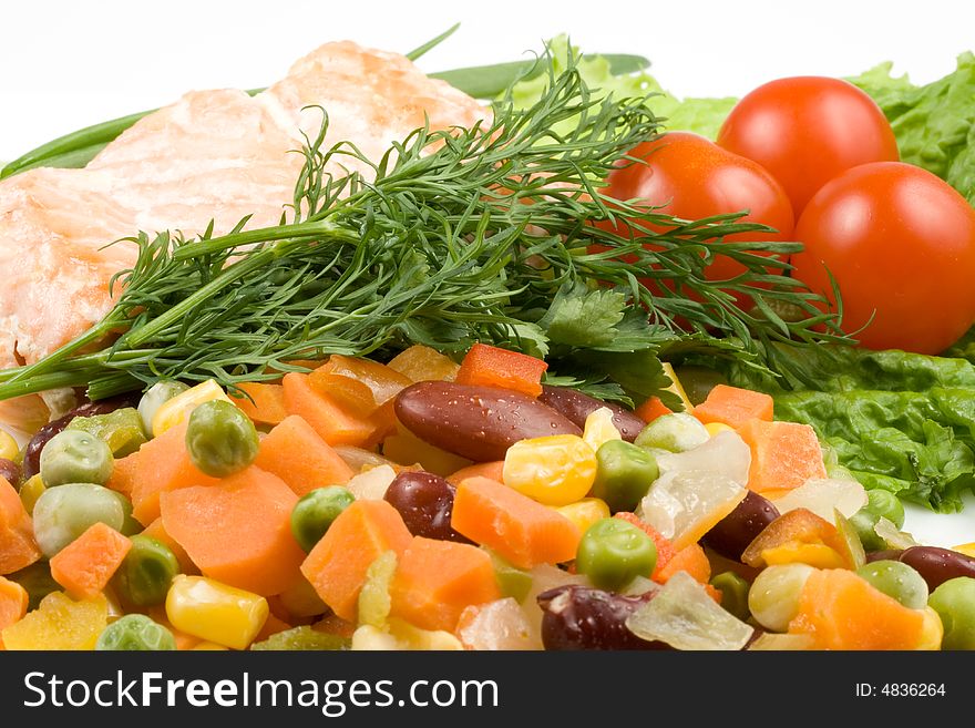 Stake from a salmon with vegetables on a plate